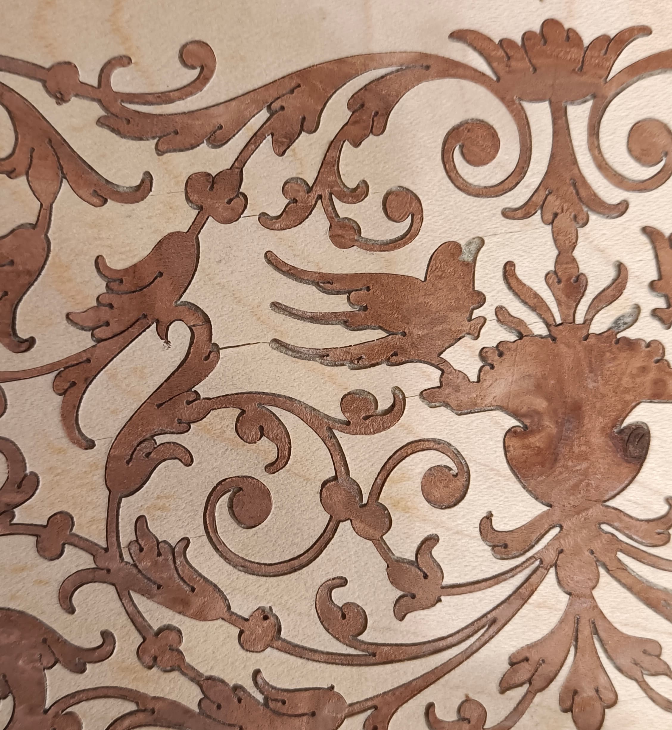 Detail: assembled wood-veneer scene before lacquering